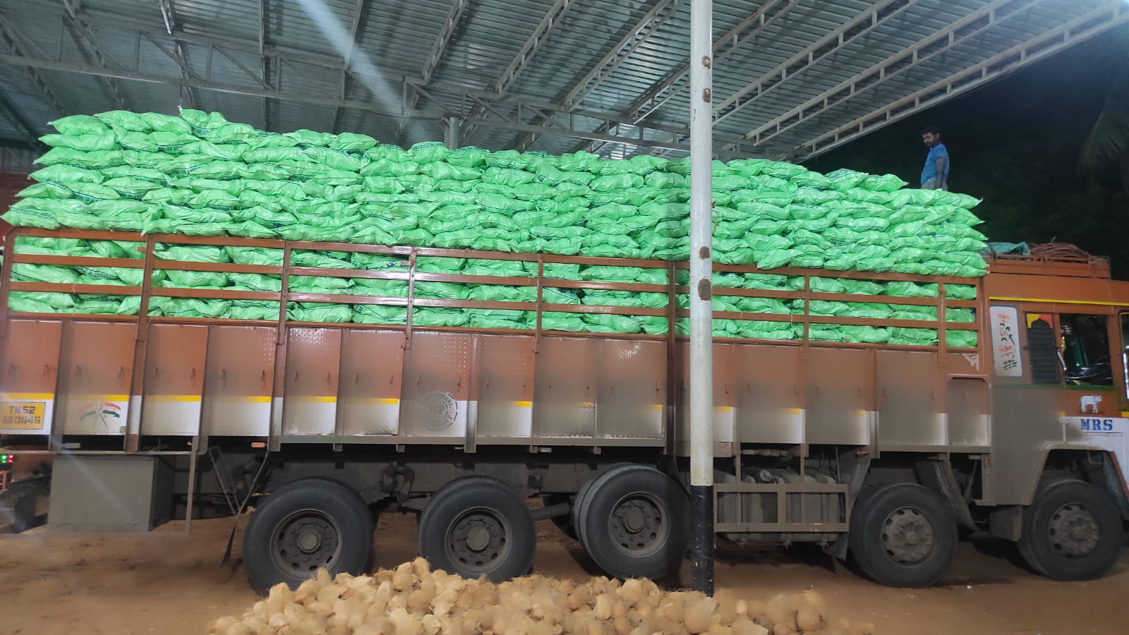 Warehouse with stacked green bags