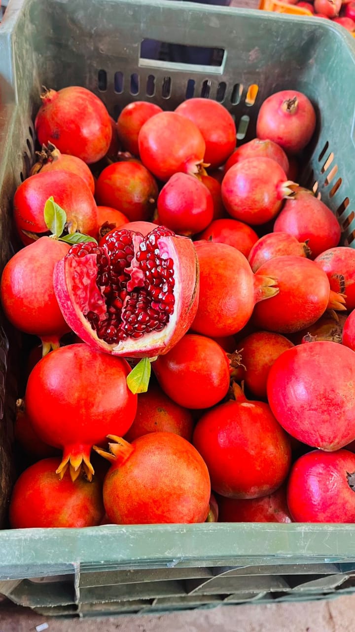 Pomegranates, one cut open