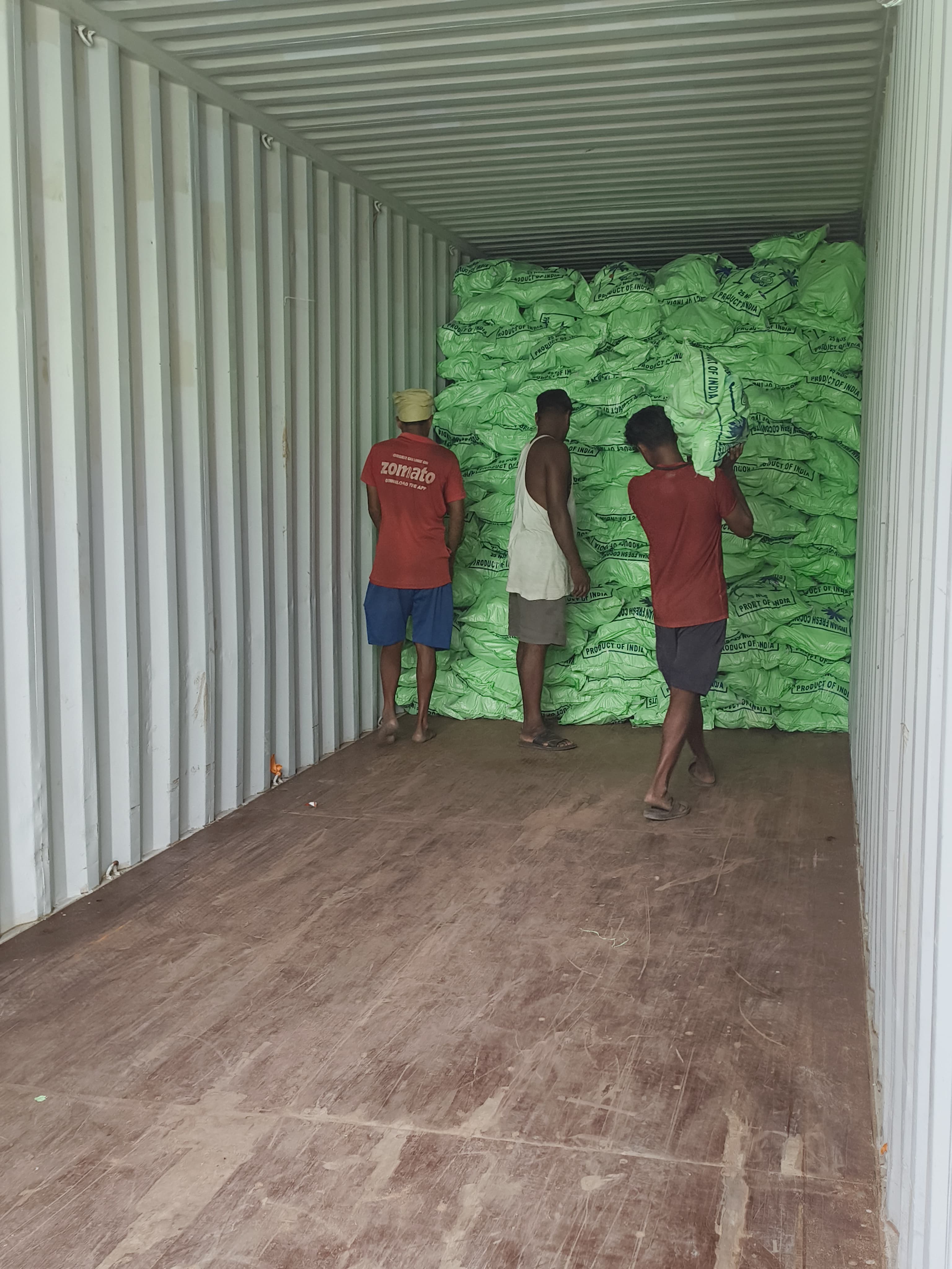Workers inside loaded container